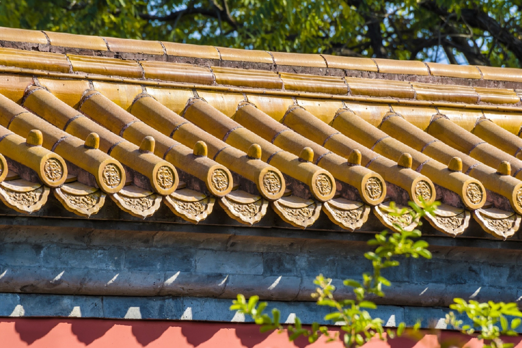 Traditional Chinese red wall and golden palace roof