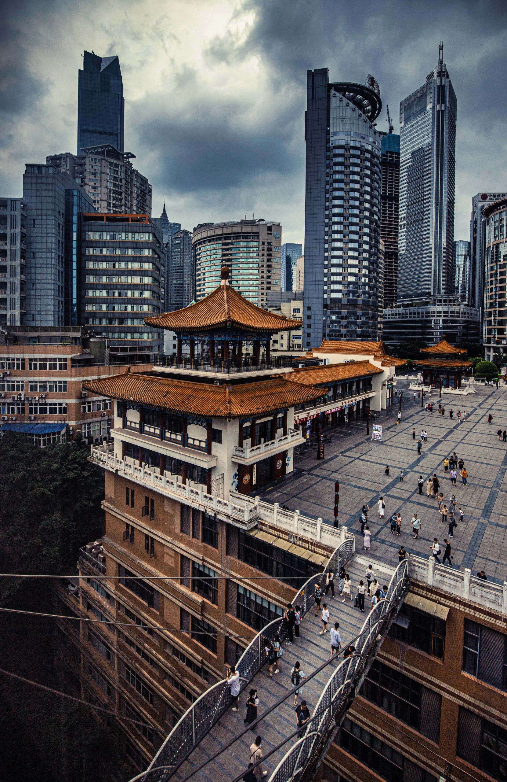 Chongqing's dramatic layered urban landscape with buildings stacked on hillsides, showcasing the Mountain City's unique three-dimensional geography