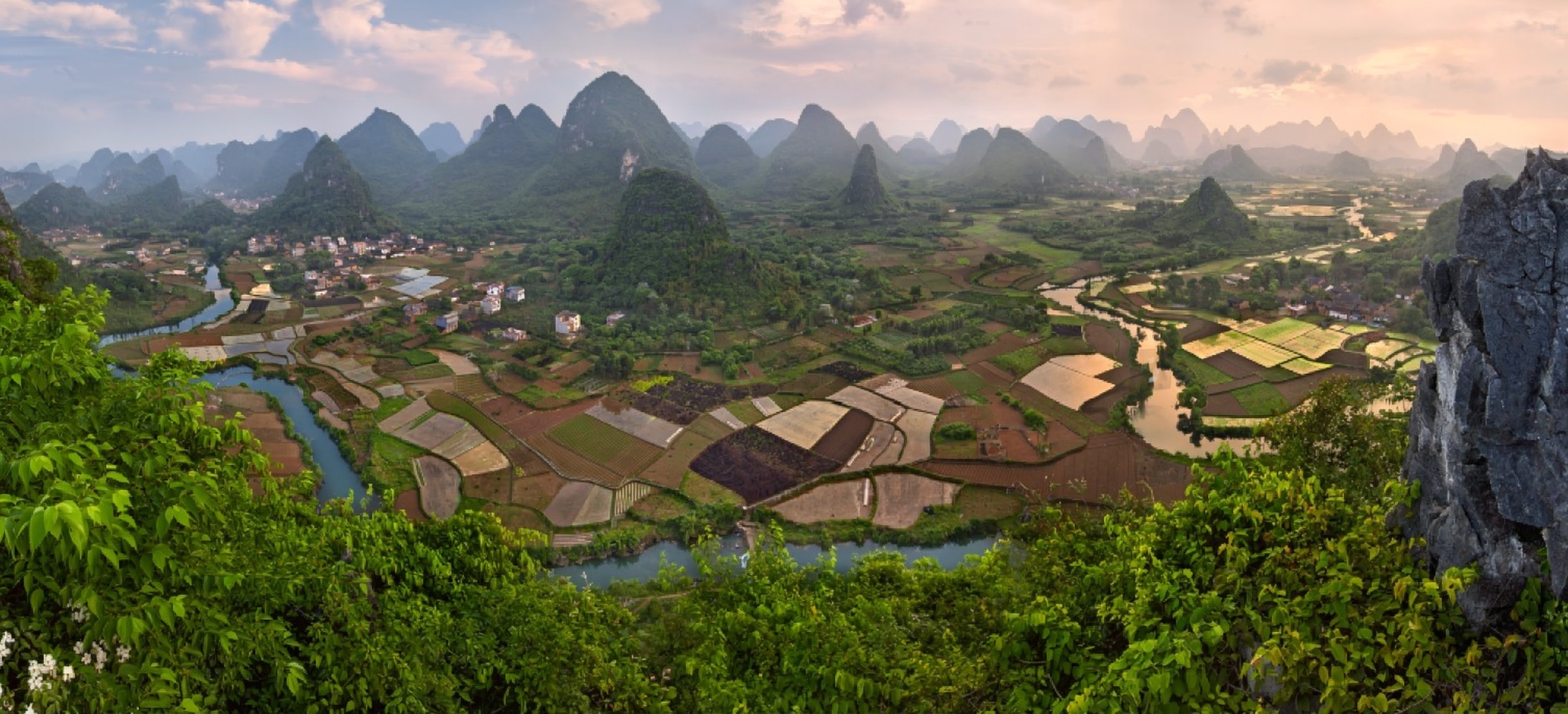 Limestone karst peaks rising from mist near Yangshuo, Guilin